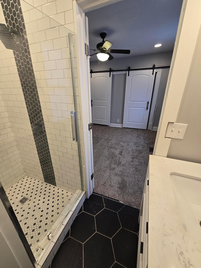 1035 Sullivant Ave, Columbus, OH 43223 - bathroom featuring a stall shower, vanity, a ceiling fan, recessed lighting, and tile patterned flooring