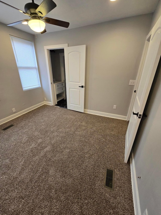 1035 Sullivant Ave, Columbus, OH 43223 - unfurnished bedroom featuring carpet floors and a ceiling fan