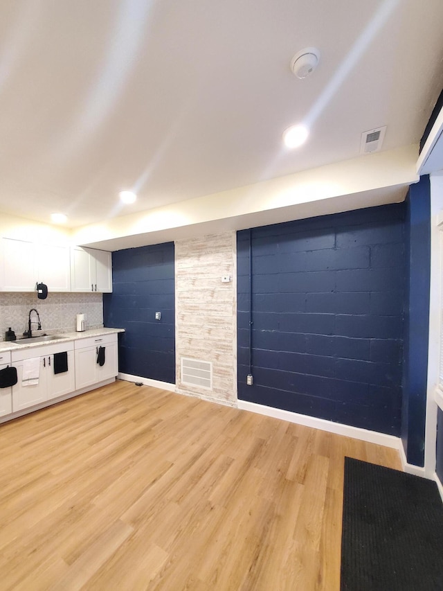 345 Dakota Ave, Columbus, OH 43223 - unfurnished living room featuring light wood-style flooring and recessed lighting