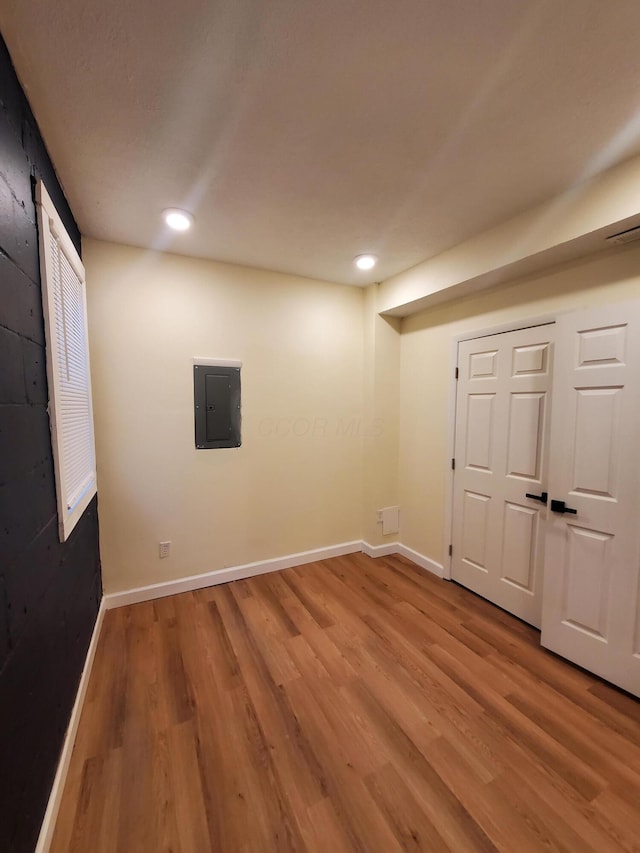 345 Dakota Ave, Columbus, OH 43223 - finished below grade area featuring wood finished floors, electric panel, and recessed lighting