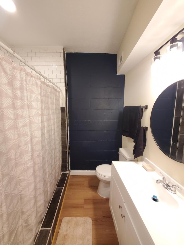 345 Dakota Ave, Columbus, OH 43223 - bathroom with vanity, wood finished floors, and curtained shower