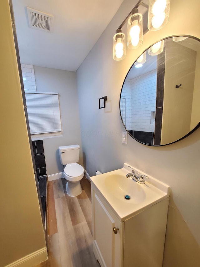 345 Dakota Ave, Columbus, OH 43223 - full bathroom featuring wood finished floors and vanity