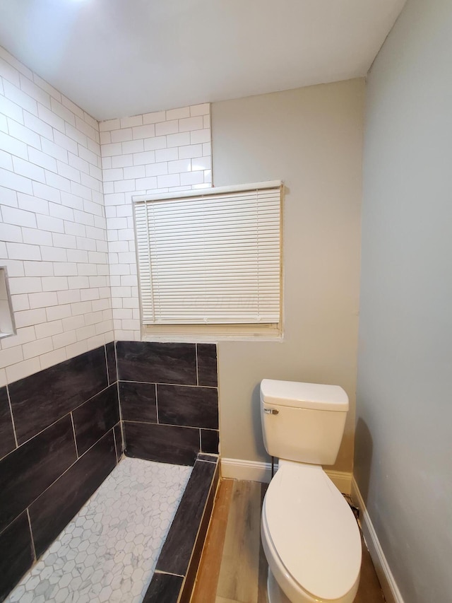 345 Dakota Ave, Columbus, OH 43223 - full bath with wood finished floors and a tile shower