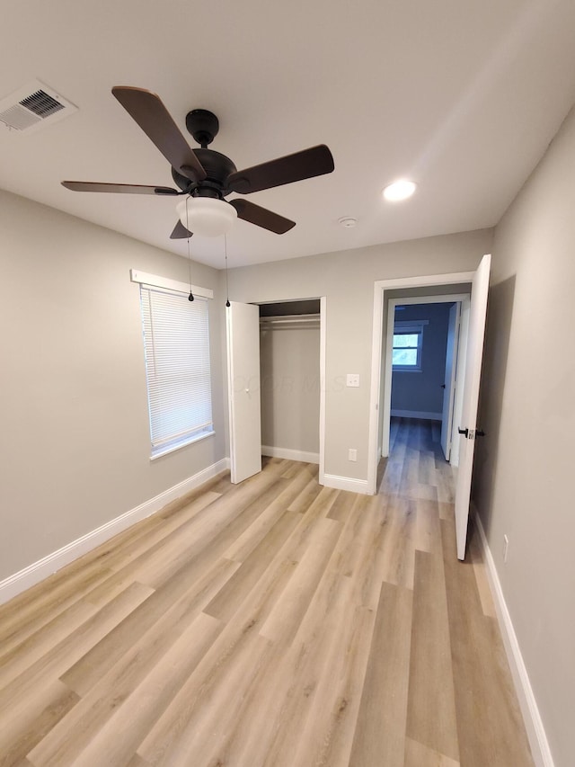 345 Dakota Ave, Columbus, OH 43223 - unfurnished bedroom featuring light wood finished floors, ceiling fan, recessed lighting, and a closet