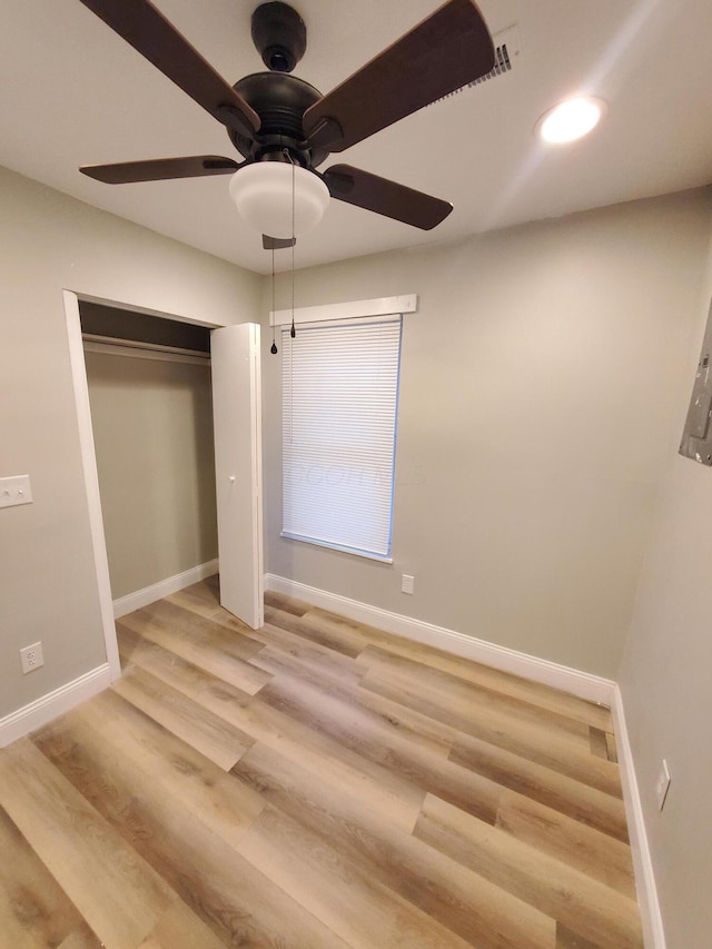 345 Dakota Ave, Columbus, OH 43223 - unfurnished bedroom with light wood finished floors, ceiling fan, and a closet