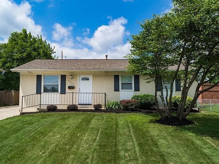 5717 Karl Rd, Columbus, OH 43229 - single story home with a porch, stucco siding, and roof with shingles