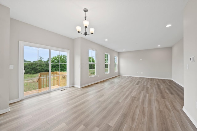 4462 Karbarda Way, Hilliard, OH 43026 - unfurnished living room featuring a chandelier, light wood-type flooring, and recessed lighting