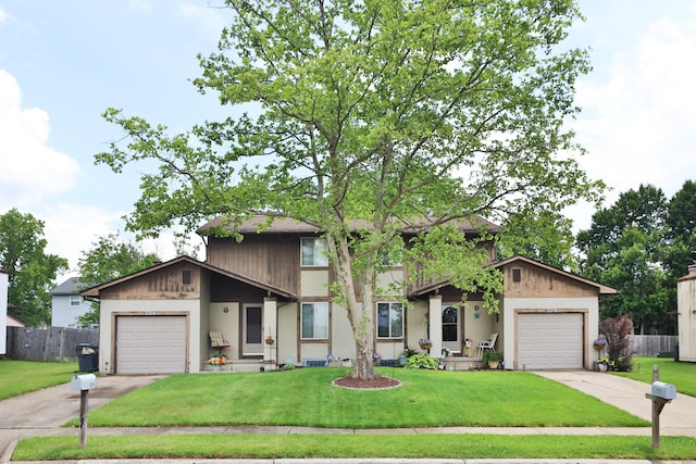 2214-2216 Pine Tree Ln, Reynoldsburg, OH 43068 - view of front facade featuring an attached garage and driveway