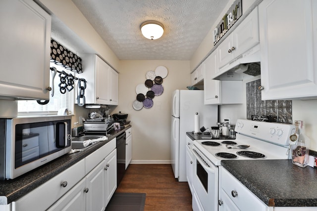 2214-2216 Pine Tree Ln, Reynoldsburg, OH 43068 - kitchen featuring electric stove, under cabinet range hood, stainless steel microwave, black dishwasher, and white cabinetry