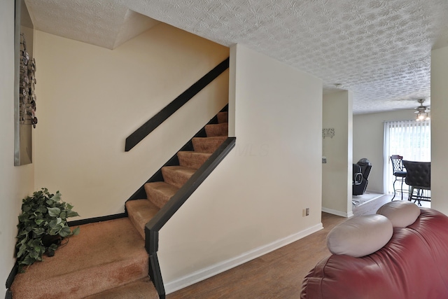 2214-2216 Pine Tree Ln, Reynoldsburg, OH 43068 - stairway with a textured ceiling and wood finished floors