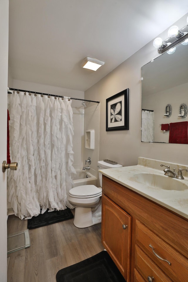 2214-2216 Pine Tree Ln, Reynoldsburg, OH 43068 - full bathroom with vanity, shower / bath combo, and wood finished floors