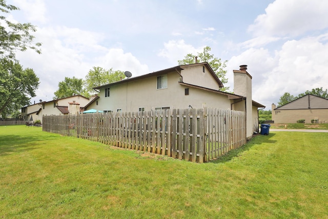 2214-2216 Pine Tree Ln, Reynoldsburg, OH 43068 - rear view of house featuring a chimney and stucco siding