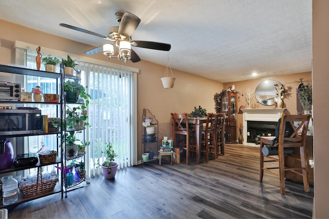 2214-2216 Pine Tree Ln, Reynoldsburg, OH 43068 - dining area featuring wood finished floors, ceiling fan, a textured ceiling, a fireplace, and recessed lighting