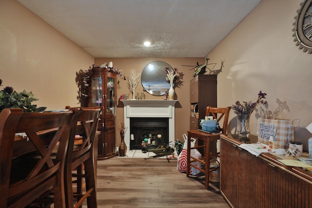 2214-2216 Pine Tree Ln, Reynoldsburg, OH 43068 - dining area featuring light wood finished floors and a fireplace