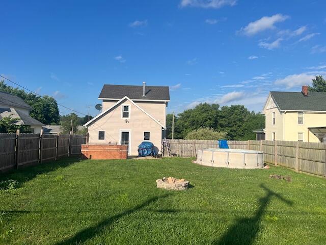 427 John St, Newark, OH 43055 - rear view of property with a fenced backyard