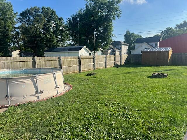 427 John St, Newark, OH 43055 - fenced backyard featuring a storage shed