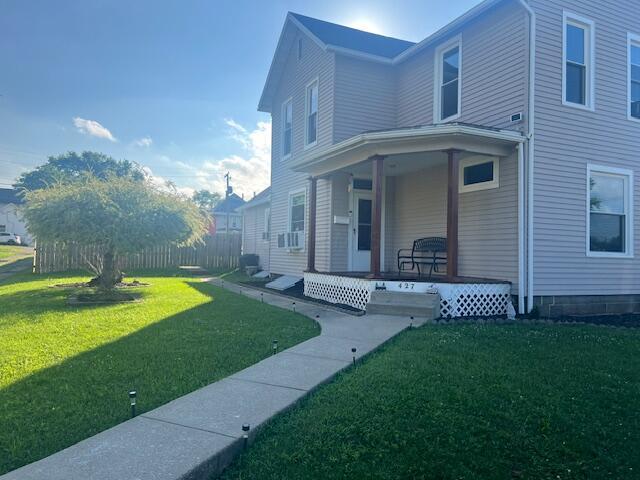 427 John St, Newark, OH 43055 - view of side of property featuring a porch and a yard