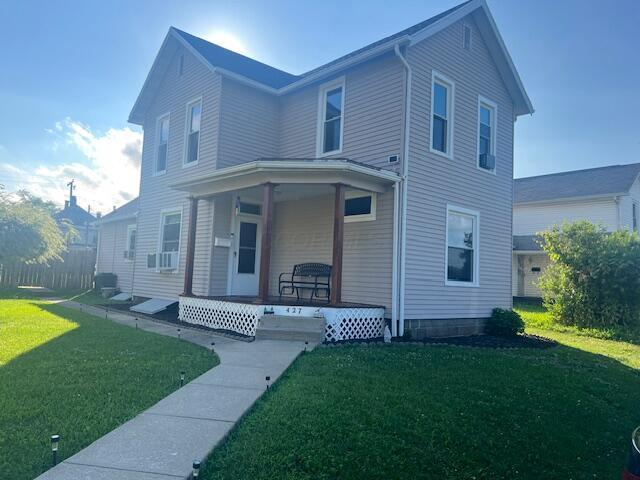 427 John St, Newark, OH 43055 - traditional-style house featuring a porch and a front lawn