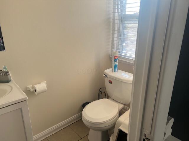 427 John St, Newark, OH 43055 - bathroom with tile patterned flooring, plenty of natural light, and vanity