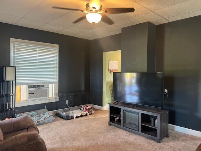 427 John St, Newark, OH 43055 - carpeted living room featuring cooling unit and ceiling fan