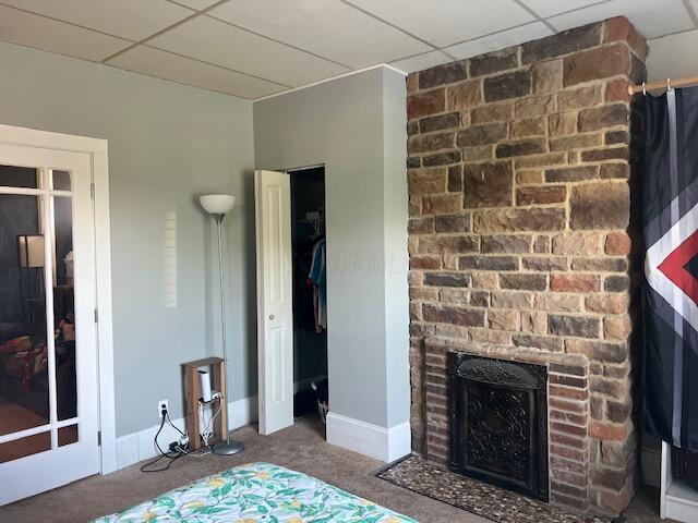 427 John St, Newark, OH 43055 - carpeted bedroom with a paneled ceiling and a fireplace