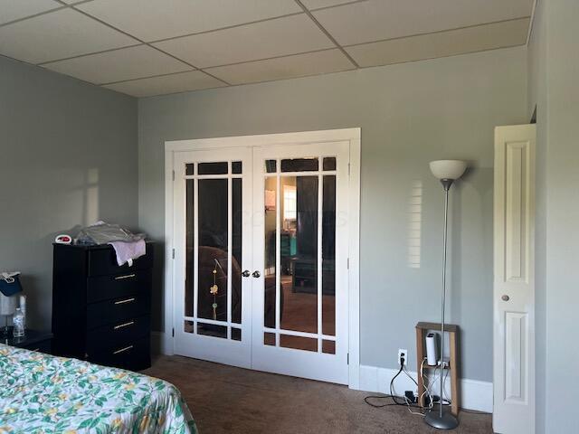 427 John St, Newark, OH 43055 - carpeted bedroom featuring french doors and a drop ceiling
