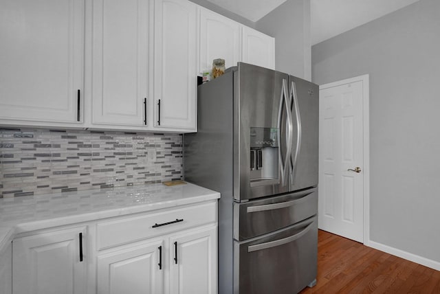 307 Timberland View Dr, Newark, OH 43055 - kitchen featuring stainless steel refrigerator with ice dispenser, tasteful backsplash, light countertops, white cabinets, and dark wood-type flooring