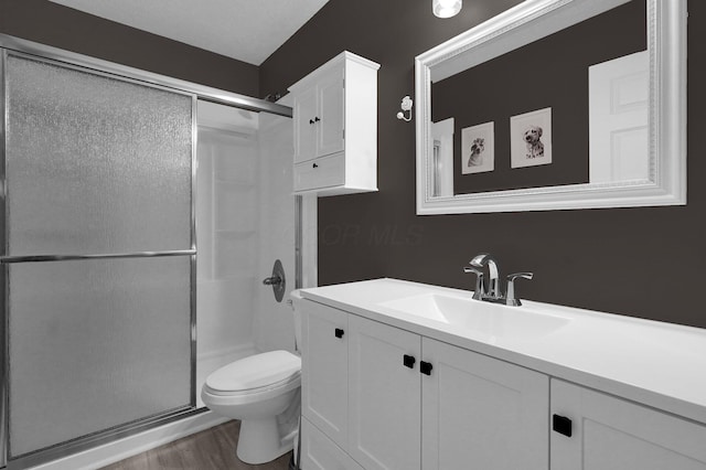 307 Timberland View Dr, Newark, OH 43055 - full bathroom with a shower stall, vanity, and wood finished floors