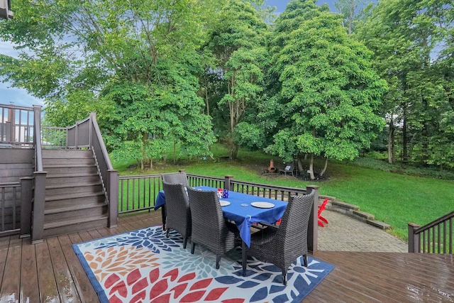 307 Timberland View Dr, Newark, OH 43055 - wooden terrace featuring outdoor dining space, stairway, a lawn, and view of scattered trees