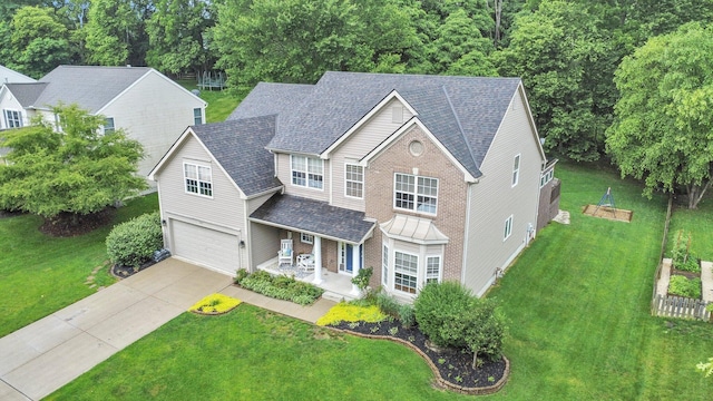 307 Timberland View Dr, Newark, OH 43055 - traditional-style home featuring covered porch, driveway, an attached garage, and a front lawn