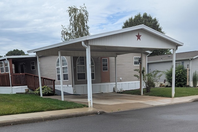 22 Birch Row Dr, Delaware, OH 43015 - manufactured / mobile home featuring a front yard and a carport