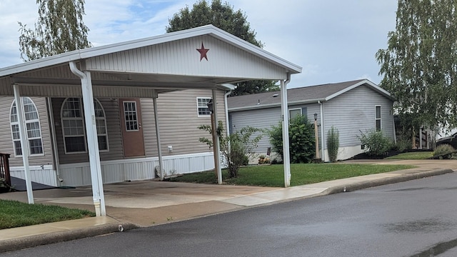 22 Birch Row Dr, Delaware, OH 43015 - view of front of property with a carport and a front yard