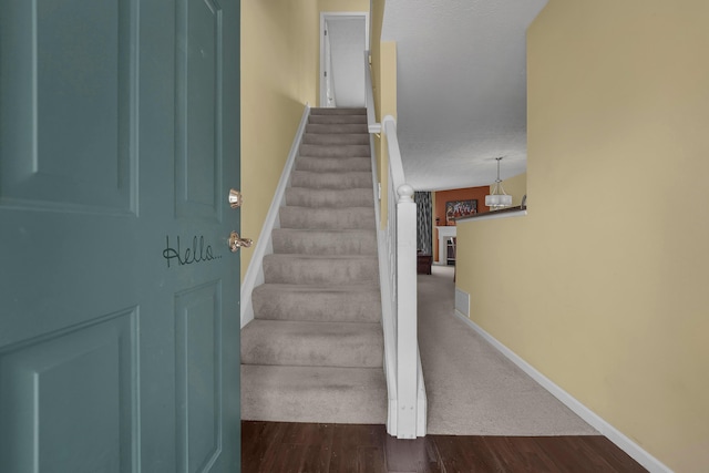 2184 Victoria Park Dr, Columbus, OH 43235 - staircase featuring baseboards and wood finished floors