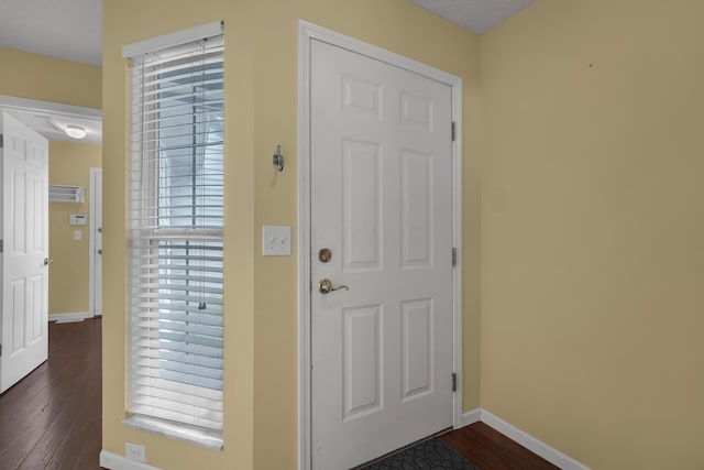 2184 Victoria Park Dr, Columbus, OH 43235 - foyer entrance featuring dark wood-style flooring and baseboards