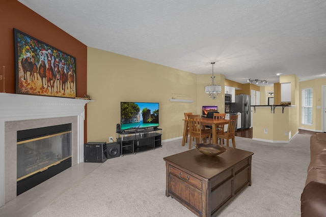 2184 Victoria Park Dr, Columbus, OH 43235 - living room featuring a glass covered fireplace and light carpet