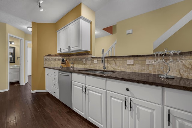 2184 Victoria Park Dr, Columbus, OH 43235 - kitchen featuring dishwasher, tasteful backsplash, white cabinetry, dark wood-style floors, and dark stone countertops