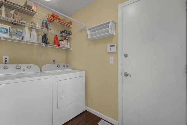 2184 Victoria Park Dr, Columbus, OH 43235 - washroom featuring independent washer and dryer, dark wood-style flooring, and a textured ceiling