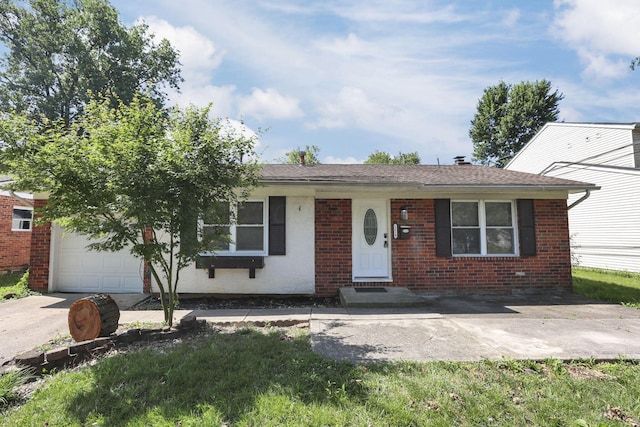 1615 Coronet Dr, Columbus, OH 43224 - view of front facade with brick siding and an attached garage