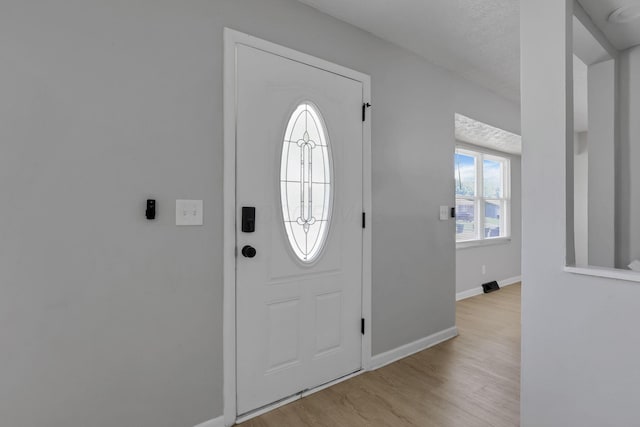 1615 Coronet Dr, Columbus, OH 43224 - entryway featuring light wood-style flooring and baseboards