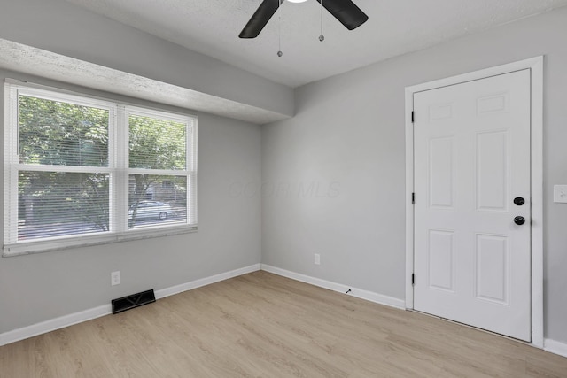 1615 Coronet Dr, Columbus, OH 43224 - spare room featuring light wood finished floors and ceiling fan