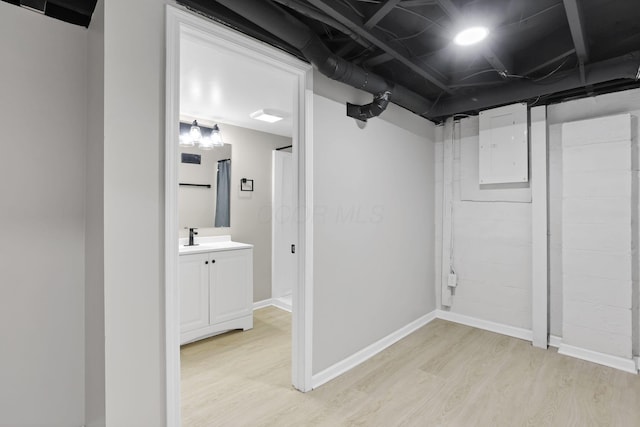 1615 Coronet Dr, Columbus, OH 43224 - finished basement with light wood-style flooring and electric panel
