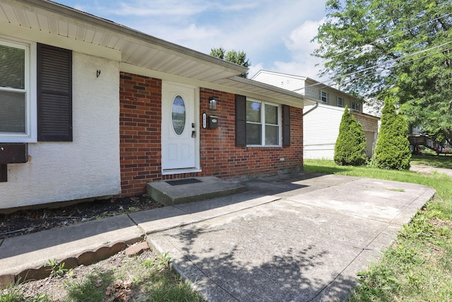 1615 Coronet Dr, Columbus, OH 43224 - property entrance featuring brick siding