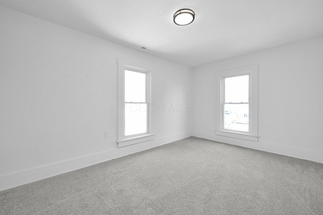 634 Columbus Ave Unit 1, Washington Court House, OH 43160 - unfurnished room with plenty of natural light and light colored carpet