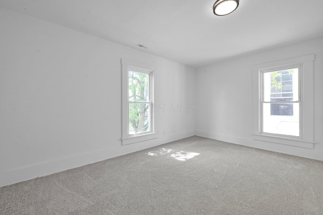 634 Columbus Ave Unit 1, Washington Court House, OH 43160 - empty room with light carpet and plenty of natural light