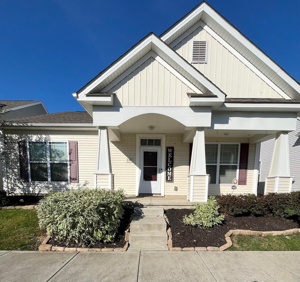 2417 English Turn Dr, Grove City, OH 43123 - view of front of house with a porch and board and batten siding