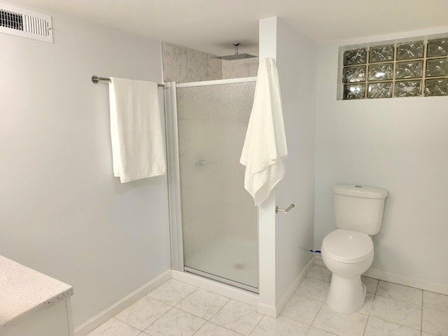 570 N Ohio Ave, Columbus, OH 43203 - bathroom featuring a stall shower, vanity, and marble finish flooring