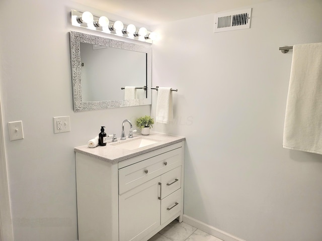 570 N Ohio Ave, Columbus, OH 43203 - bathroom with marble look tiles and vanity