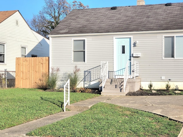 570 N Ohio Ave, Columbus, OH 43203 - view of front facade featuring a chimney and a shingled roof