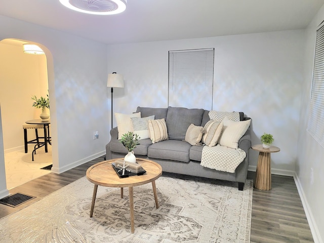 570 N Ohio Ave, Columbus, OH 43203 - living room with arched walkways and wood finished floors