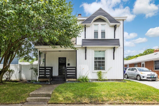 225 N Hague Ave, Columbus, OH 43204 - view of front of property with covered porch, board and batten siding, a gate, and a chimney